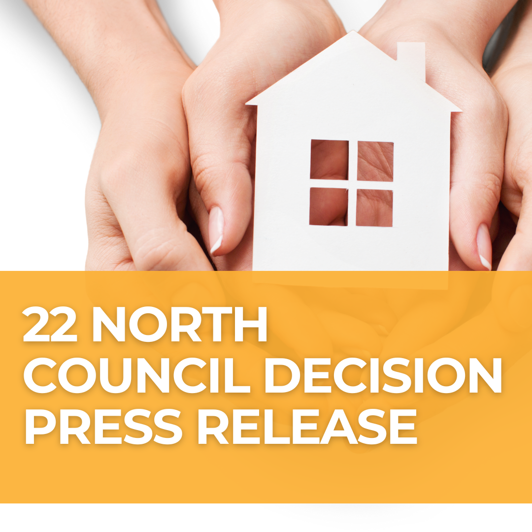 A photo of two pairs of hands holding a paper cutout of a house, with a teal banner over the photo that says "22 North Council Decision Press Release"