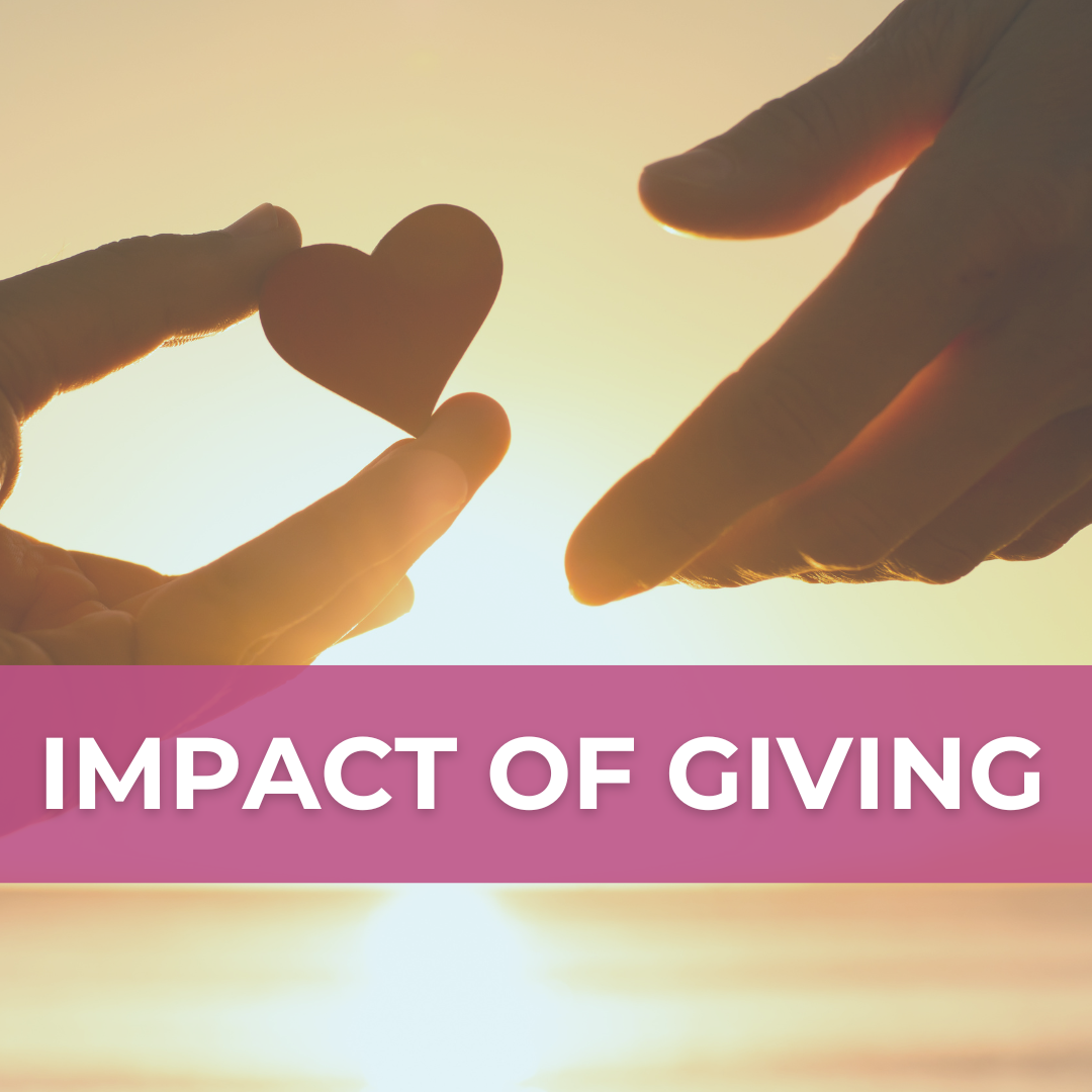 Sunset-tinged photo of a person extending a heart-shaped object to another hand. A magenta banner over the scene says "Impact of Giving."