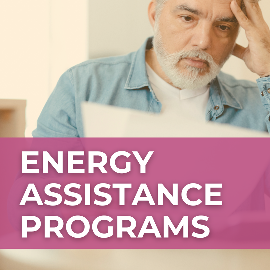 A man with white hair and beard puzzles over a piece of paper. A magenta banner over the photo says, "Energy Assistance Programs."